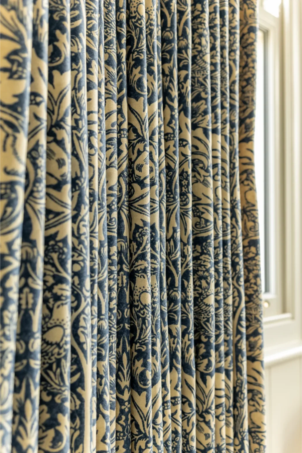 Elegant floral-patterned curtains in natural light.