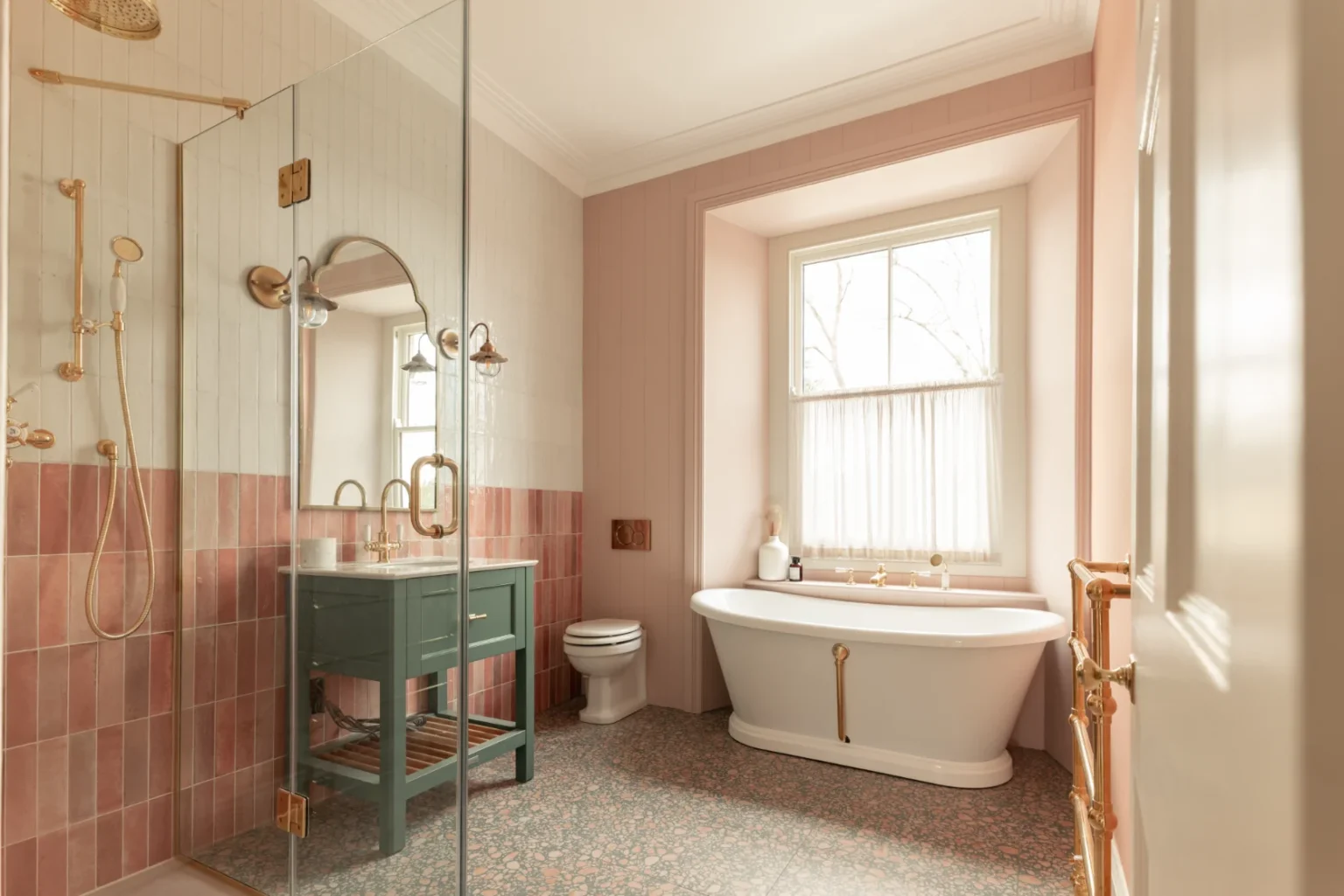 Elegant bathroom with bathtub and pink tiles