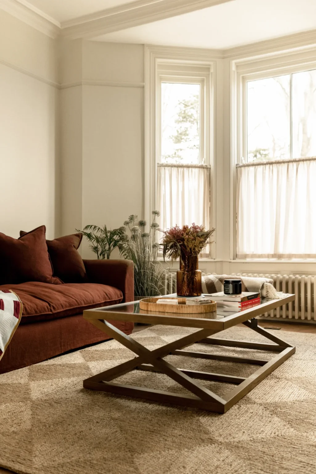 Cozy living room with brown sofa and table.