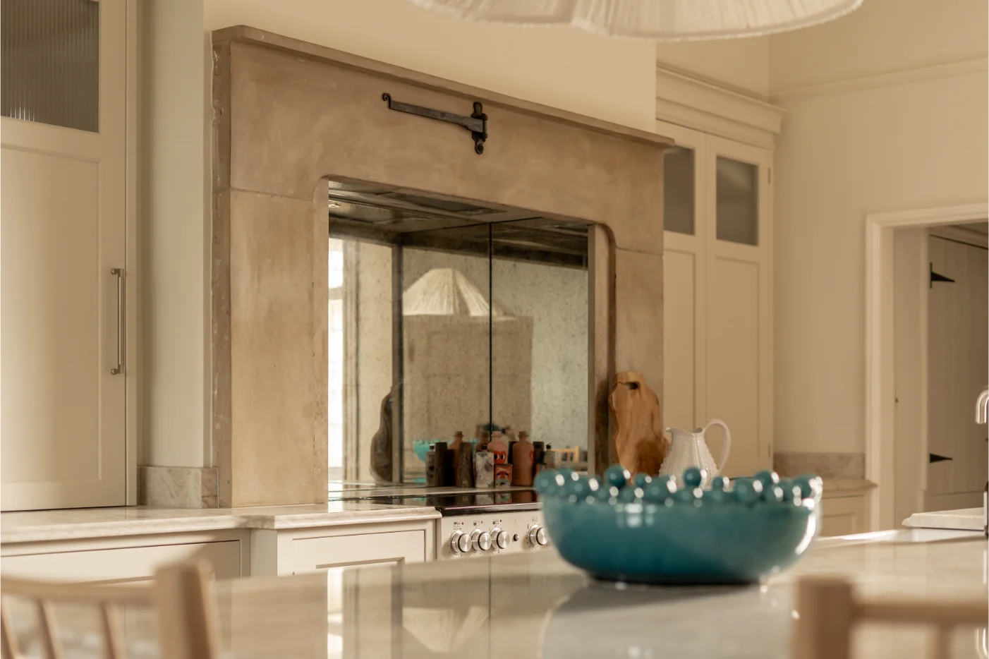 Modern kitchen with blue bowl on counter.