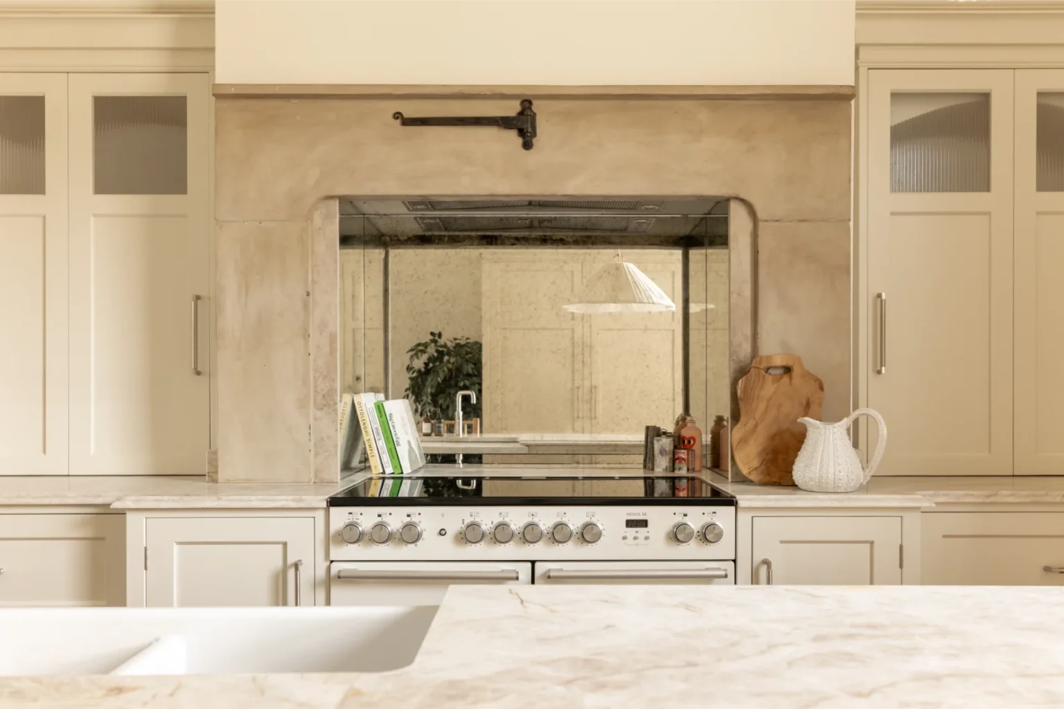 Modern kitchen with stove and marble countertops