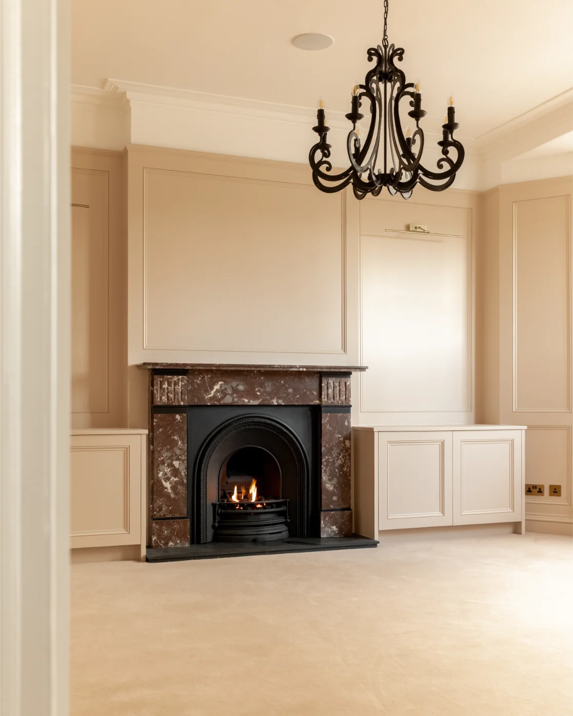 Elegant room with fireplace and chandelier