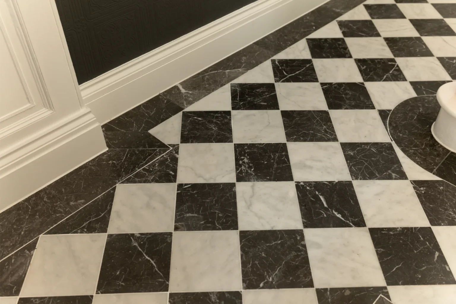 Black and white checkerboard floor tiles.