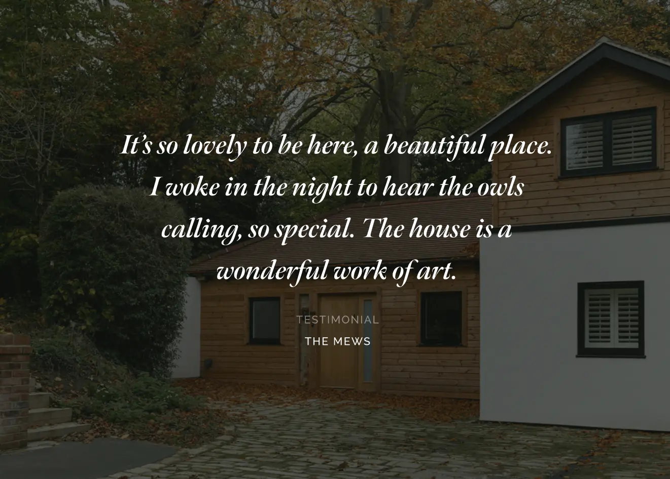 Charming house surrounded by lush greenery and trees.